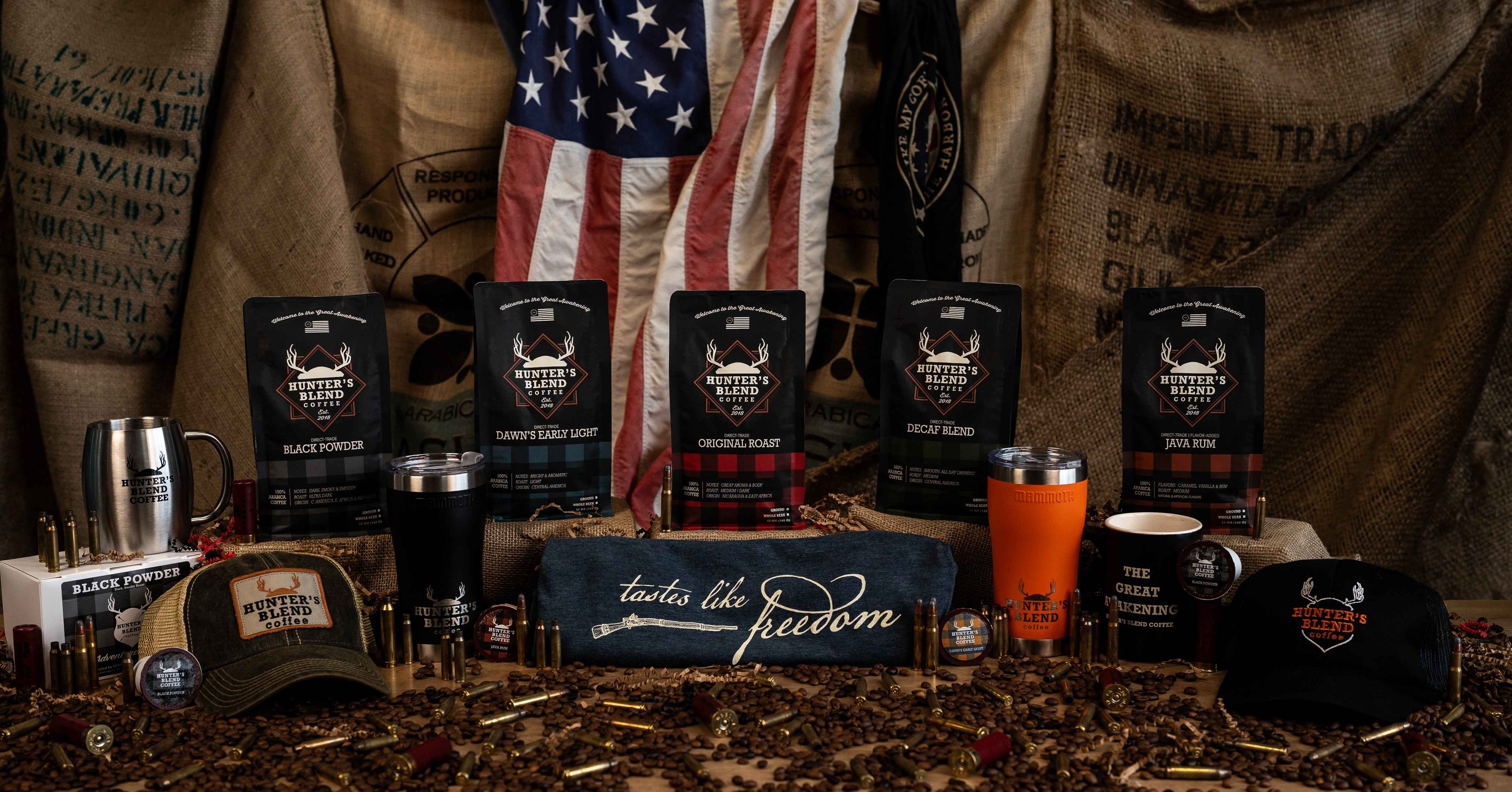 Collection of coffee products and branded merchandise with an American flag in the background.